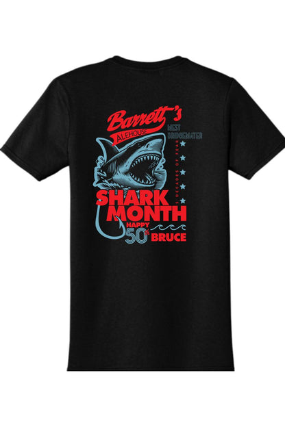 Black cotton t-shirt featuring a red and blue Shark Month 2025 graphic with a shark illustration on the back.