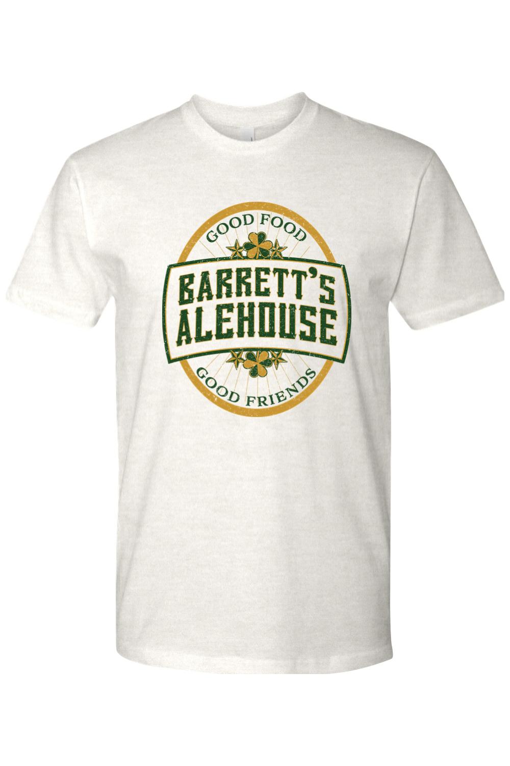 White cotton unisex t-shirt featuring a green and gold Barrett's Alehouse logo with shamrock accents.