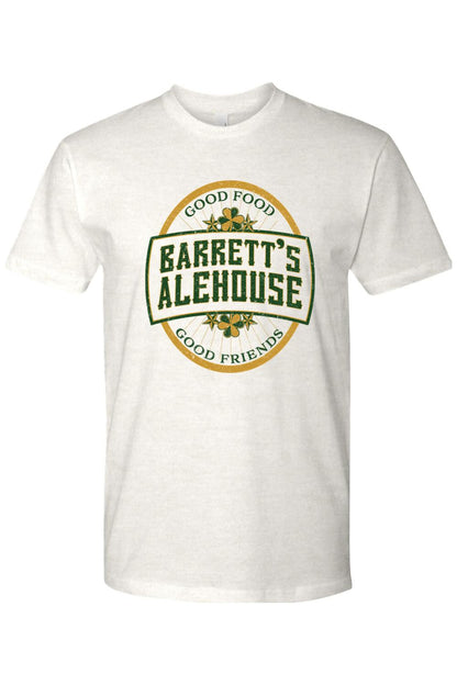White cotton unisex t-shirt featuring a green and gold Barrett's Alehouse logo with shamrock accents.