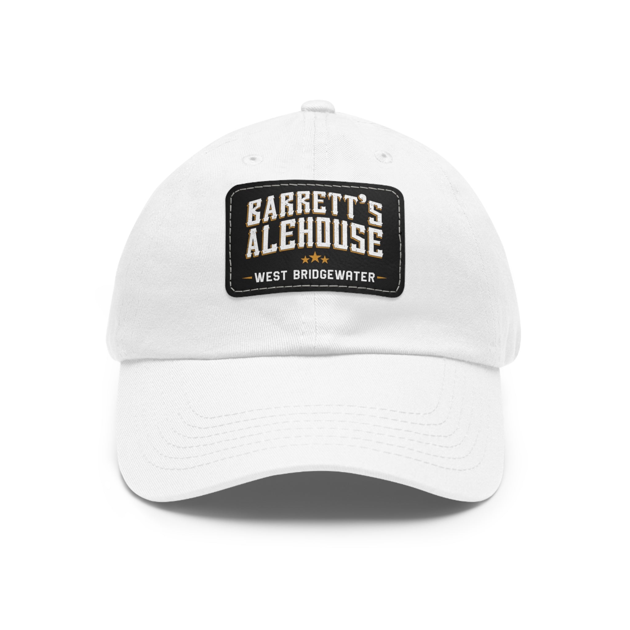 White unstructured dad hat with a black faux leather patch featuring the Barrett's Alehouse West Bridgewater logo.