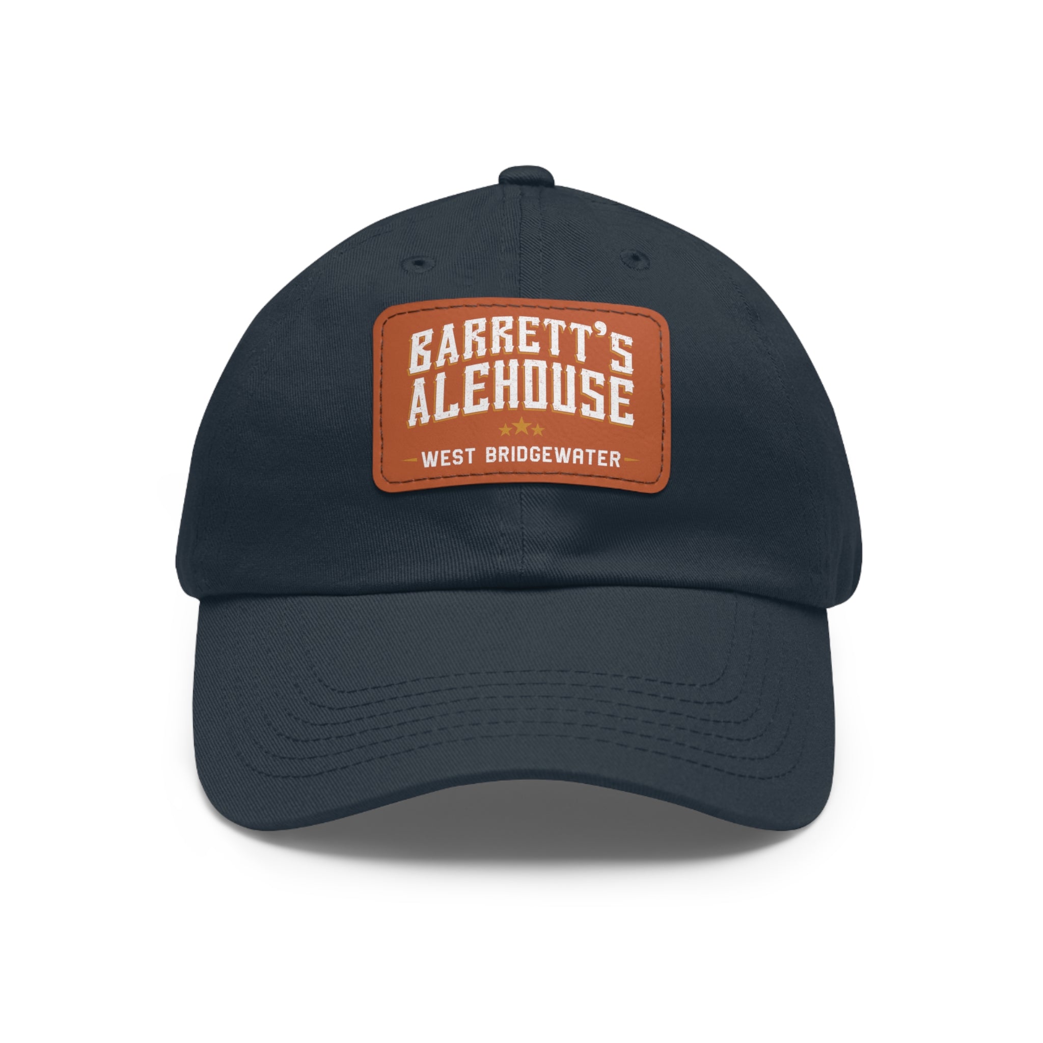 Navy blue bio-washed chino twill dad hat featuring a brown faux leather patch with Barrett's Alehouse branding.