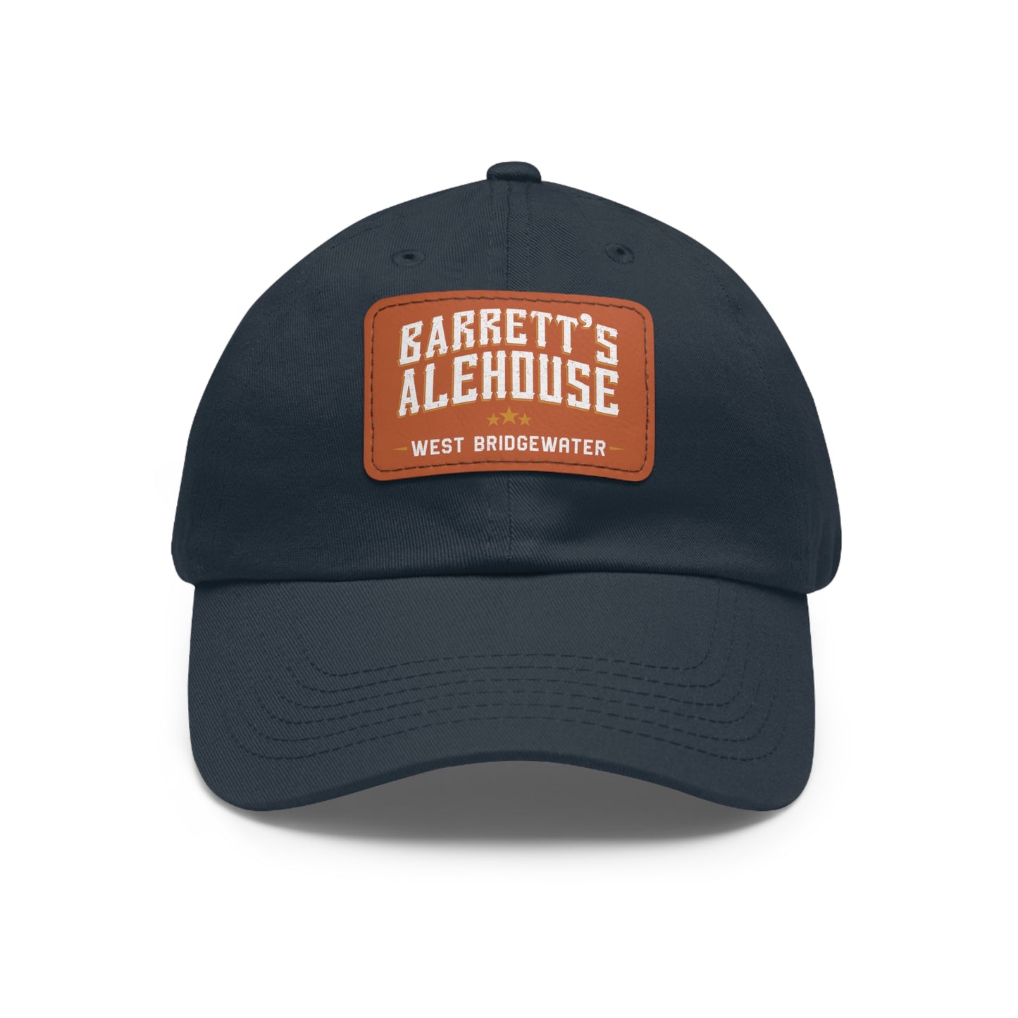 Navy blue bio-washed chino twill dad hat featuring a brown faux leather patch with Barrett's Alehouse branding.