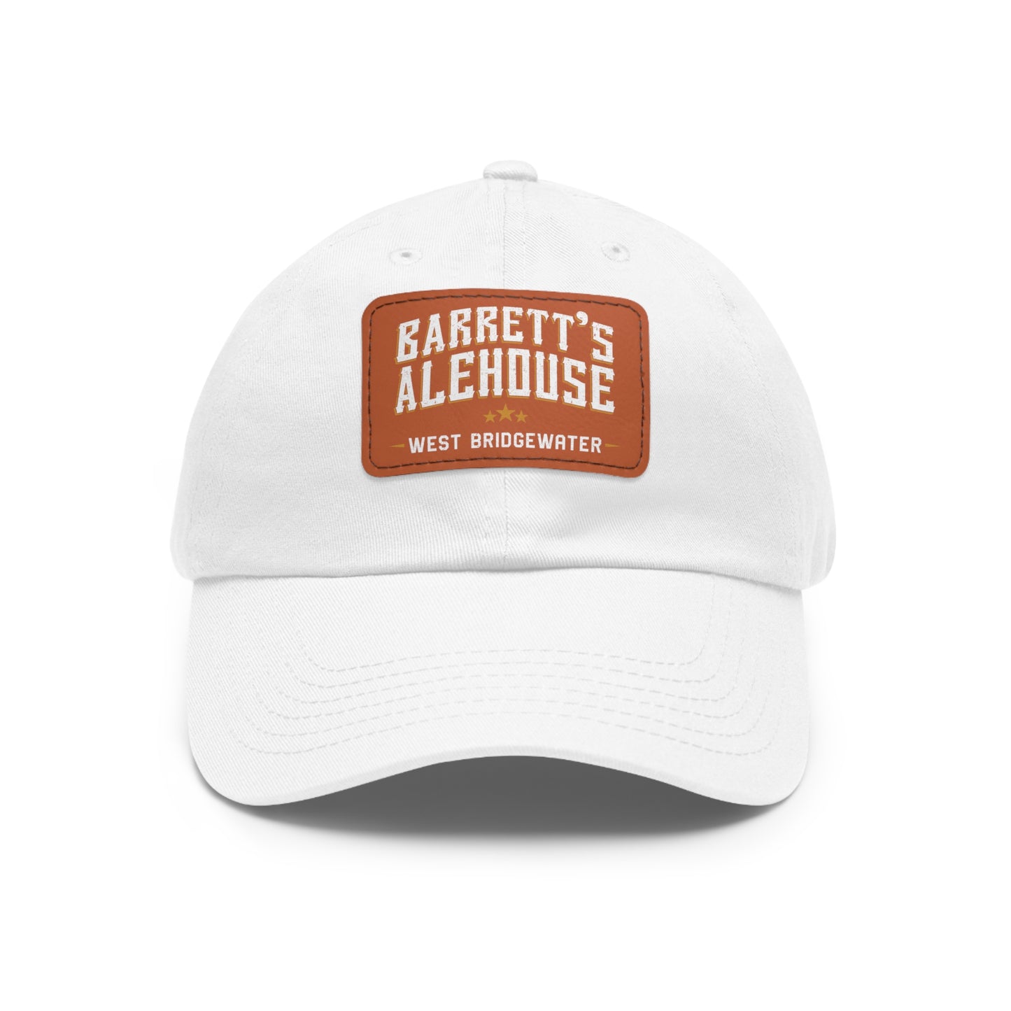White unstructured dad hat with a brown faux leather patch featuring the Barrett's Alehouse West Bridgewater logo.