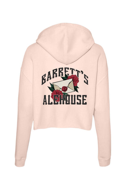 Light pink cropped hoodie featuring a back graphic of a letter, red roses, and Barrett's Alehouse text in black.