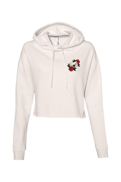 Cream-colored cropped hoodie featuring a small embroidered envelope and red rose graphic on the chest.