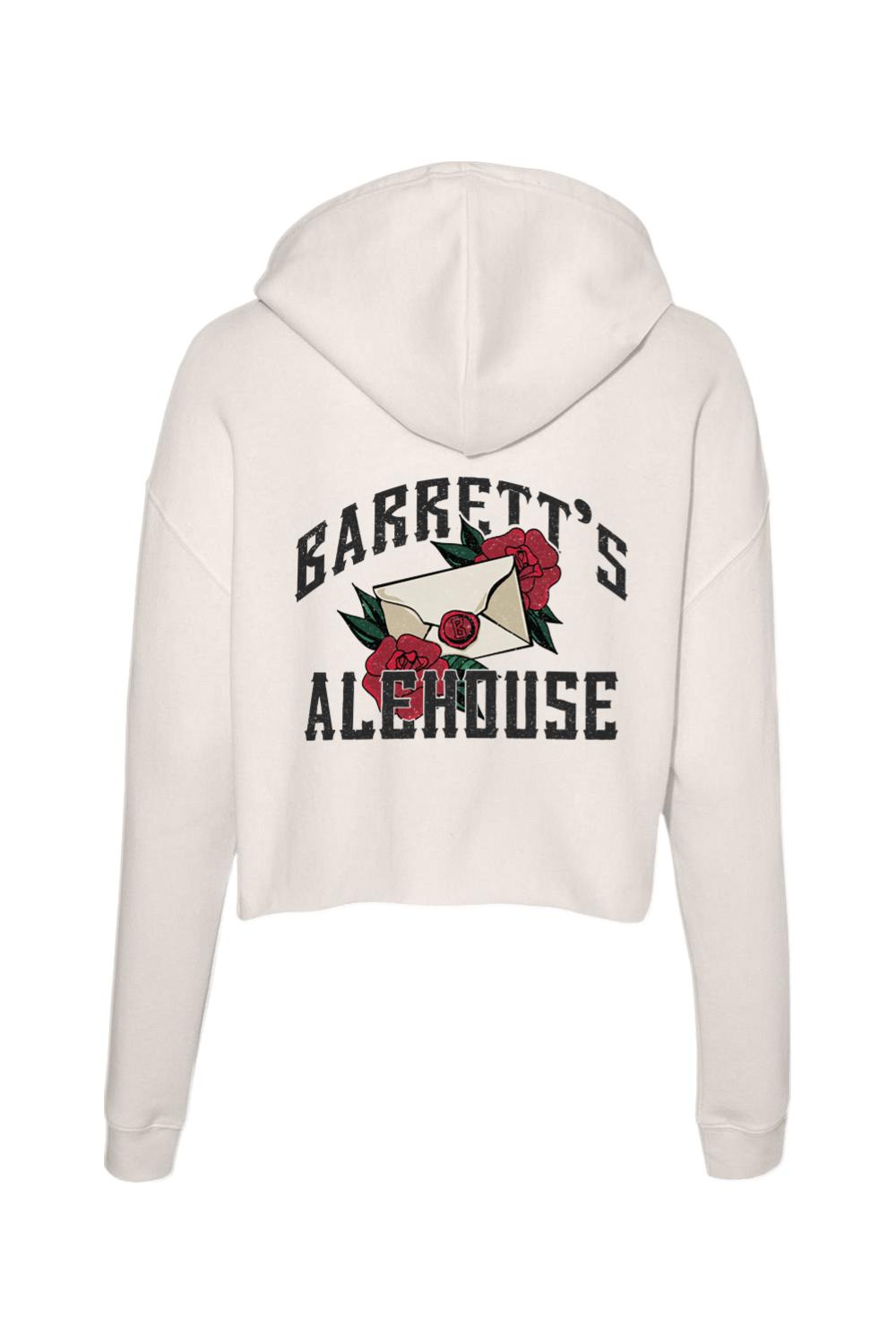 Cream-colored cropped hoodie featuring a back graphic of a letter, red roses, and Barrett's Alehouse text.