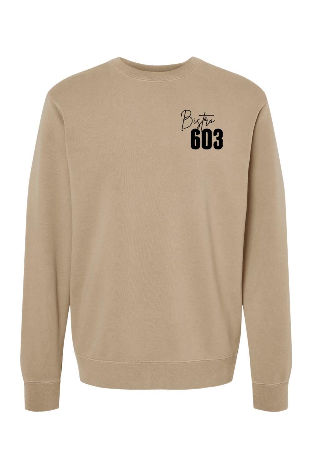 Tan pigment-dyed crewneck sweatshirt featuring a black Bistro 603 logo on the chest in a soft cotton-blend fabric.