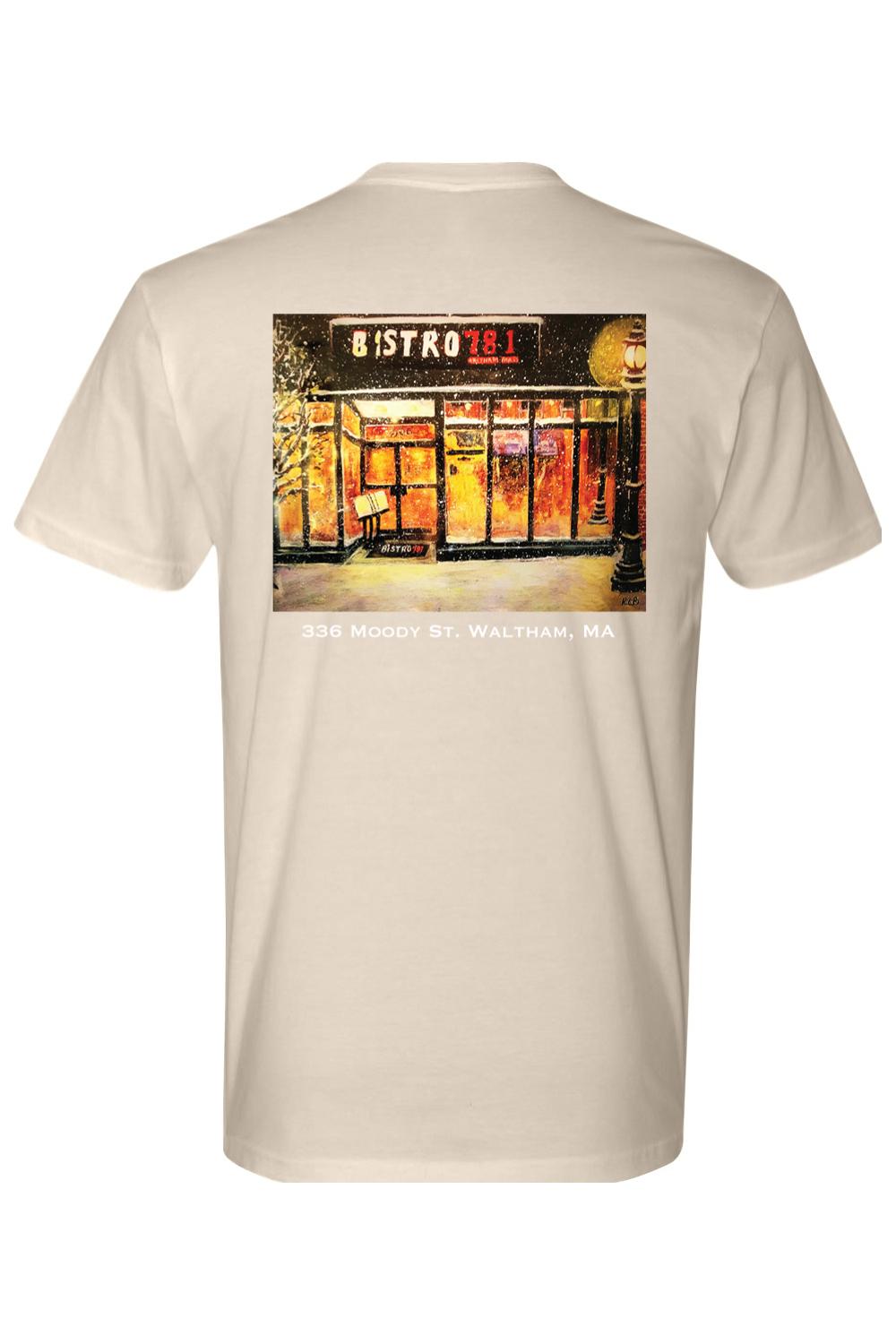 Beige 100% cotton t-shirt featuring a snowy Bistro 781 storefront graphic on the back with Waltham, MA text.