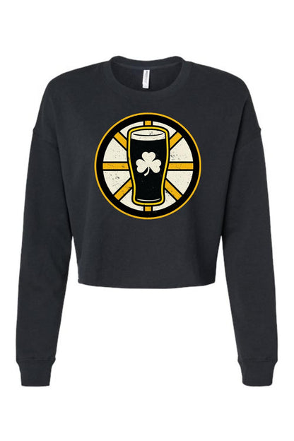 Black women's crop sweatshirt featuring a graphic of a beer glass with a shamrock inside a yellow and black wheel.