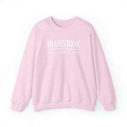 Light pink crewneck sweatshirt with white Bluestone Kitchen + Bar logo, featuring a loose fit and cotton-blend fabric.