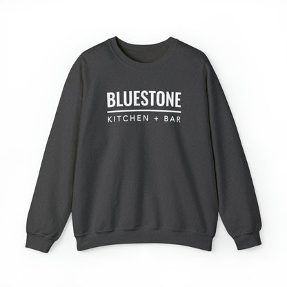 Dark gray heavy blend crewneck sweatshirt featuring white Bluestone Kitchen + Bar text on the chest.