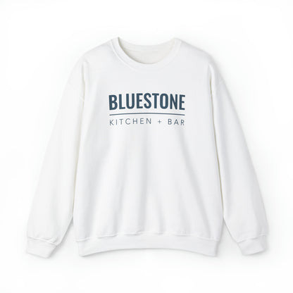 White crewneck sweatshirt with a loose fit, featuring Bluestone Kitchen + Bar text in dark blue on the chest.