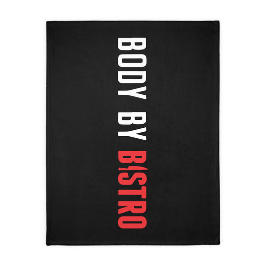 Soft black velveteen minky blanket with vertical white and red Body by Bistro text and a stitched edge.