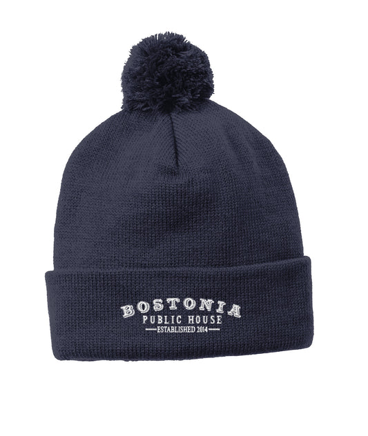 Navy blue 100% acrylic cuff beanie with a matching pom pom and white Bostonia Public House logo embroidery.