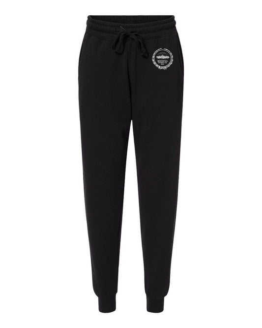 Black Bostonia fleece joggers with an elastic drawstring waistband, side pockets, and a white circular logo on the hip.