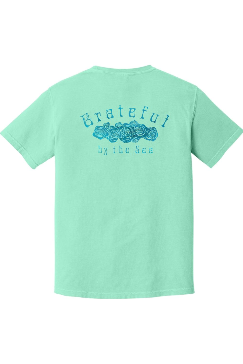 Mint green Comfort Colors t-shirt featuring a blue rose graphic and Grateful by the Sea text on the back.