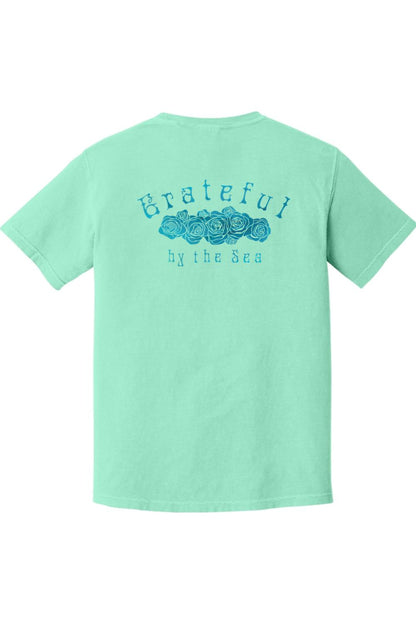 Mint green Comfort Colors t-shirt featuring a blue rose graphic and Grateful by the Sea text on the back.