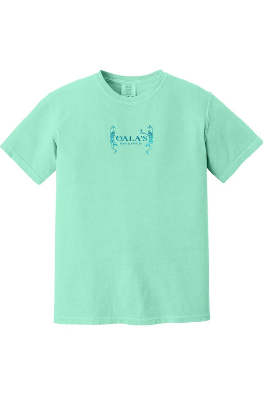 Mint green Comfort Colors unisex t-shirt featuring a small blue Cala's Food & Spirits logo with dancing skeletons.