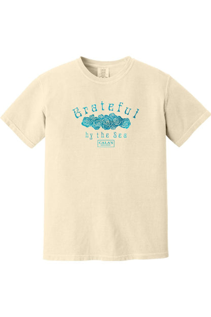 Cream-colored Comfort Colors t-shirt featuring a blue Grateful By The Sea rose graphic and Cala's Food & Spirits logo.
