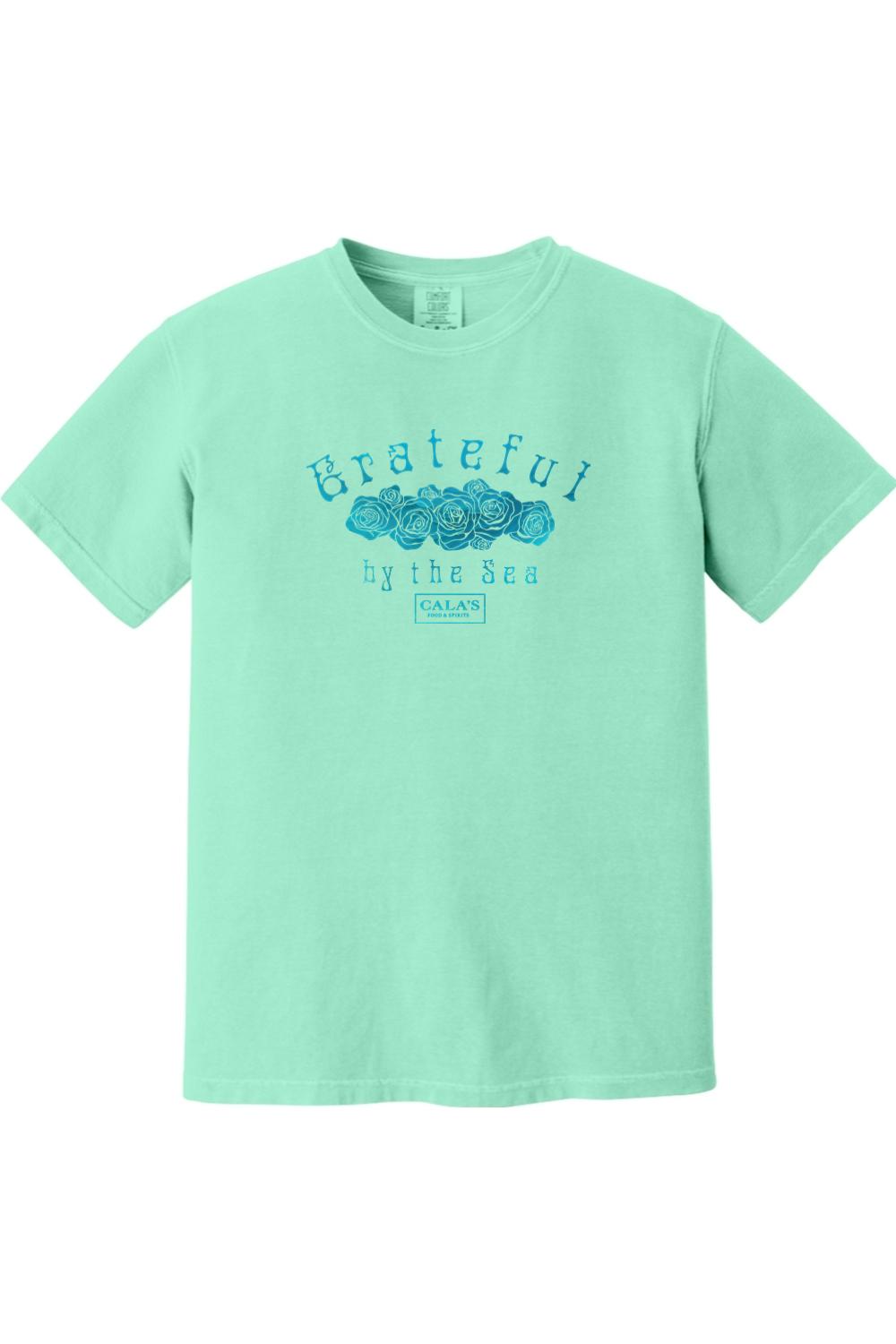 Mint green Comfort Colors unisex t-shirt featuring a blue Grateful By The Sea rose graphic on the chest.