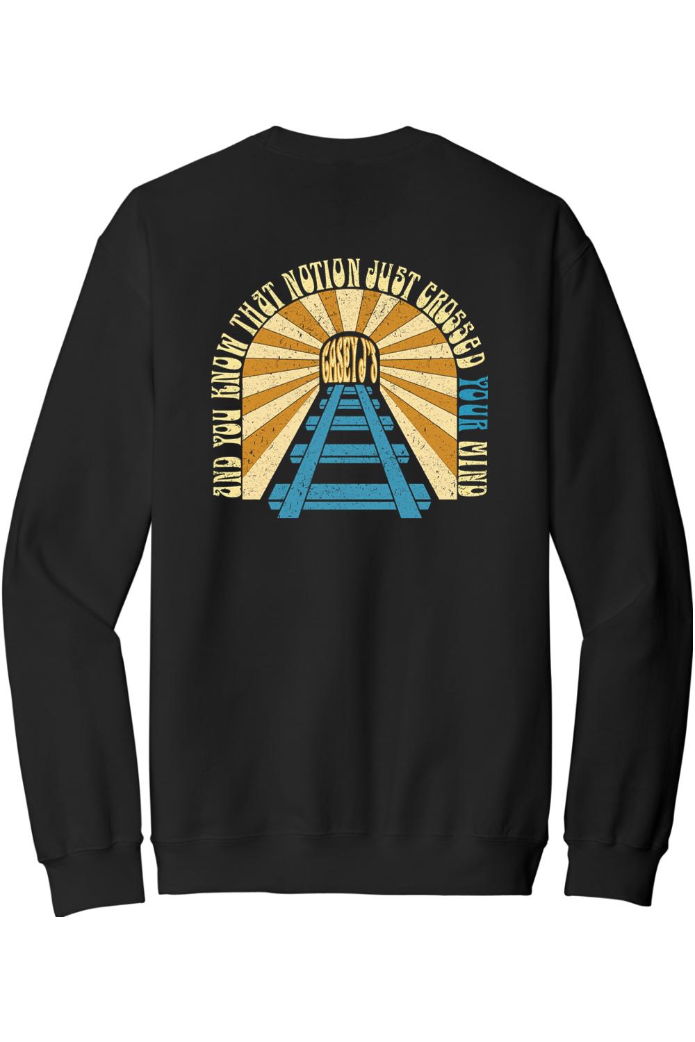 Black crewneck sweatshirt featuring a vintage-style train tunnel graphic with sunset rays and Casey J's text.