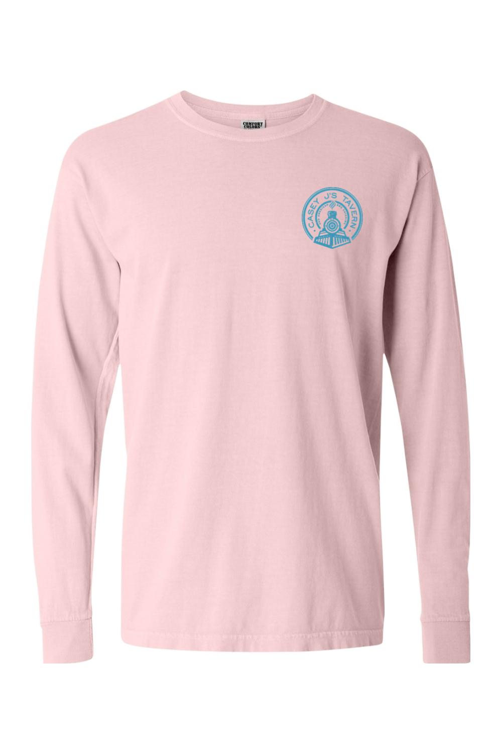 Light pink Comfort Colors long sleeve t-shirt featuring a small blue Casey J's Tavern train logo on the chest.