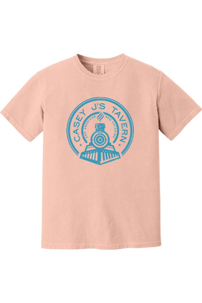 Soft peach Comfort Colors t-shirt featuring a blue Casey J's Tavern train logo graphic on the front.