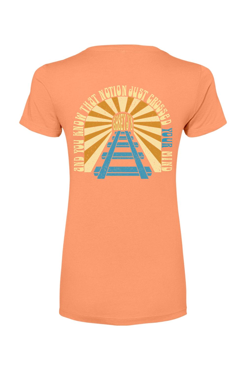 Peach women's cotton-blend t-shirt featuring a retro sunburst graphic with railroad tracks and Casey J's Tavern text.