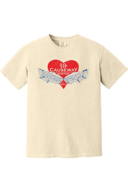 Cream-colored Comfort Colors short sleeve shirt featuring a red heart graphic with blue wings and Causeway 10th anniversary text.