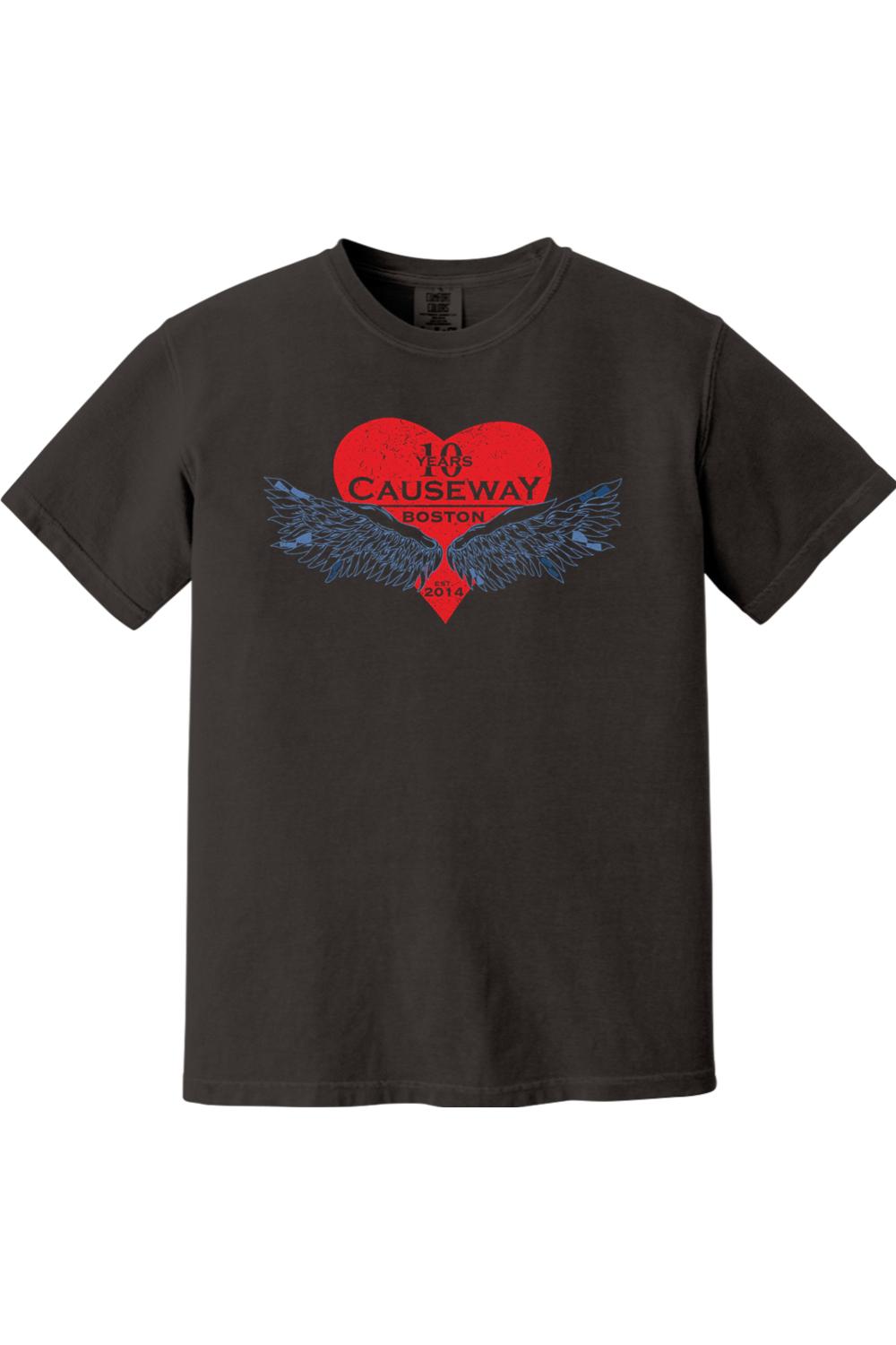 Black Comfort Colors short-sleeve shirt featuring a red heart graphic with blue wings and Causeway 10th anniversary text.
