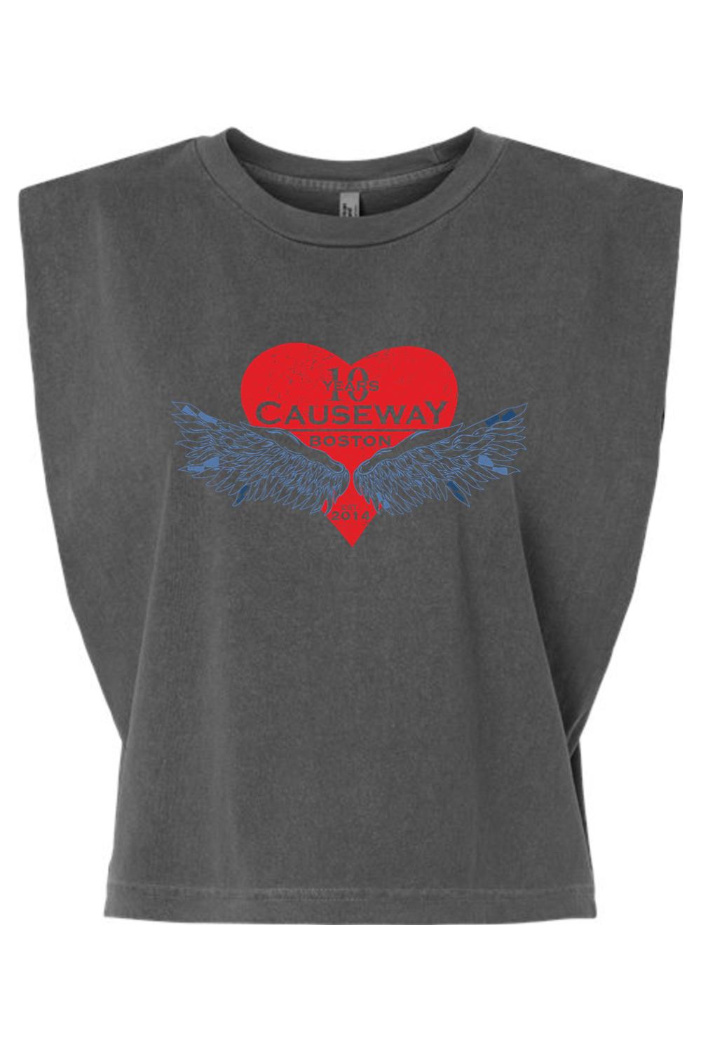 Charcoal garment-dyed women's muscle tee with a boxy, cropped fit and a red heart graphic featuring 10th anniversary wings.