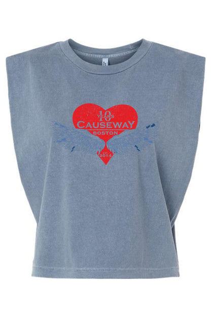 Blue garment-dyed women's muscle tee with a boxy, cropped fit and a red heart and wing 10th anniversary graphic.