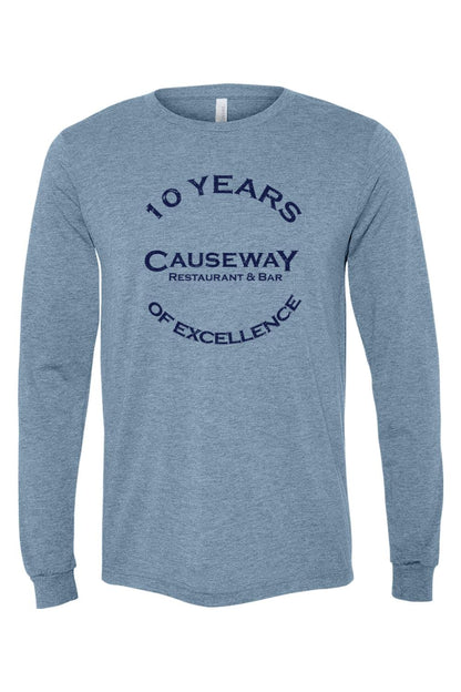 Blue heathered triblend long sleeve tee featuring a navy 10th anniversary Causeway Restaurant & Bar graphic.