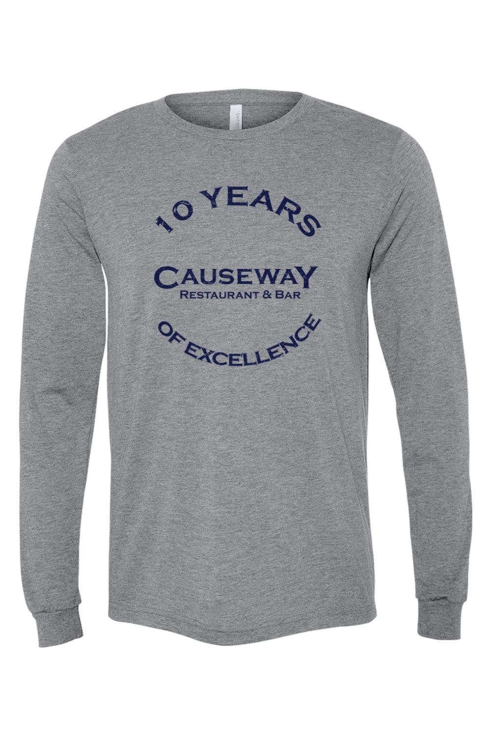 Grey triblend long sleeve tee featuring a navy blue 10th anniversary Causeway Restaurant & Bar graphic print.