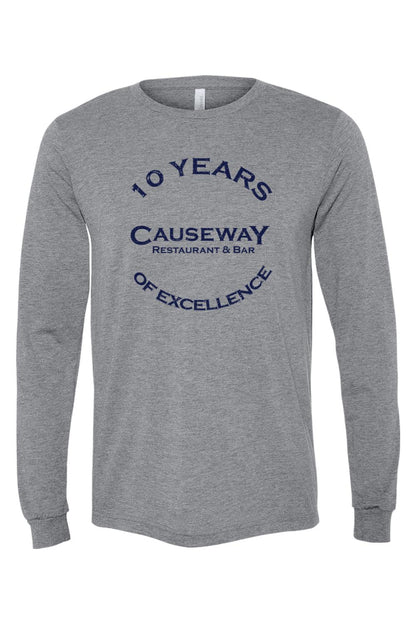 Grey triblend long sleeve tee featuring a navy blue 10th anniversary Causeway Restaurant & Bar graphic print.