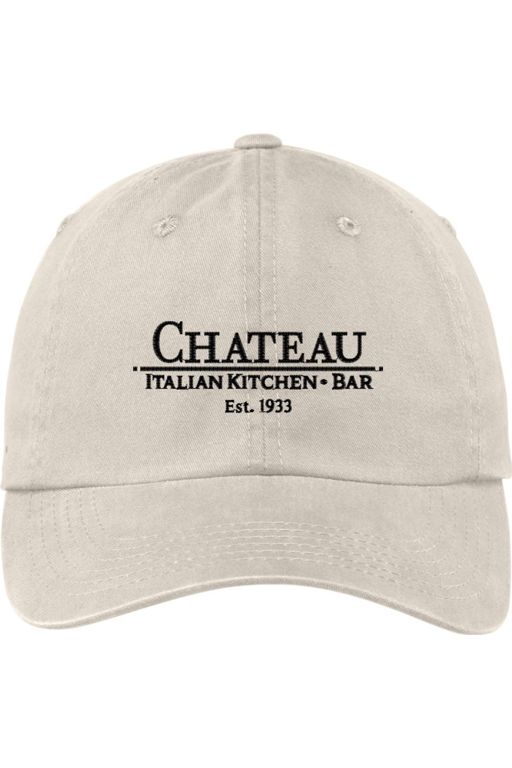 Beige pigment-dyed cotton twill cap with unstructured six-panel design and Chateau Italian Kitchen + Bar embroidery.