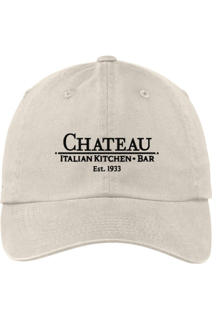 Beige pigment-dyed cotton twill cap with unstructured six-panel design and Chateau Italian Kitchen + Bar embroidery.
