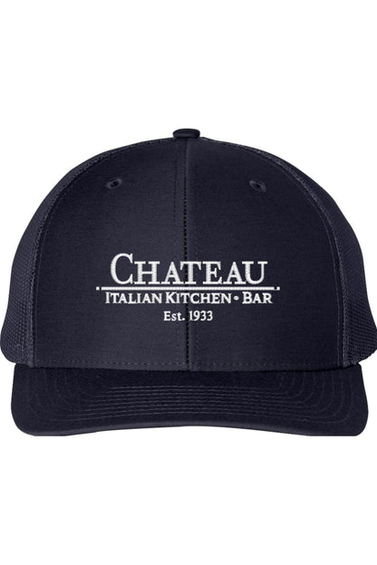 Navy blue structured trucker cap with white Chateau Italian Kitchen + Bar logo embroidery and breathable mesh back.