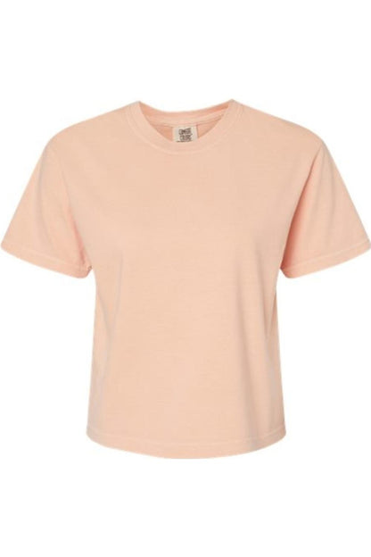 Peach-colored Comfort Colors heavyweight boxy t-shirt in garment-dyed cotton with a classic ribbed crew neck.