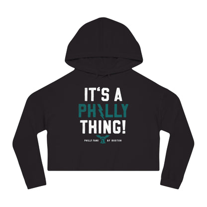 Black cropped graphic hoodie featuring It's A Philly Thing text with a bell icon in white and teal print.