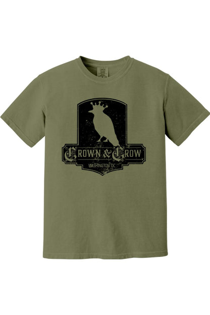 Olive green garment-dyed cotton t-shirt featuring a black distressed Crown & Crow graphic logo on the chest.