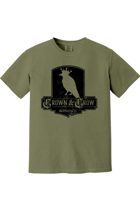 Olive green garment-dyed cotton t-shirt featuring a black distressed Crown & Crow graphic logo on the chest.
