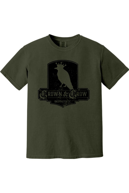 Olive green garment-dyed cotton t-shirt featuring a black distressed Crown & Crow logo graphic on the chest.