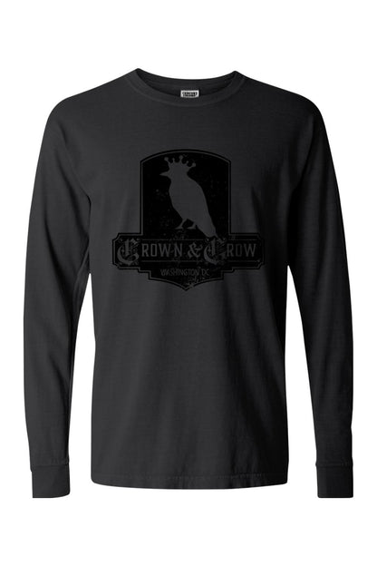Black garment-dyed long sleeve t-shirt featuring a distressed Crown & Crow logo graphic on the chest.