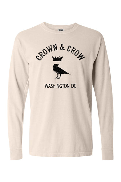 Beige garment-dyed long sleeve cotton t-shirt featuring a black Crown & Crow Washington DC graphic on the chest.