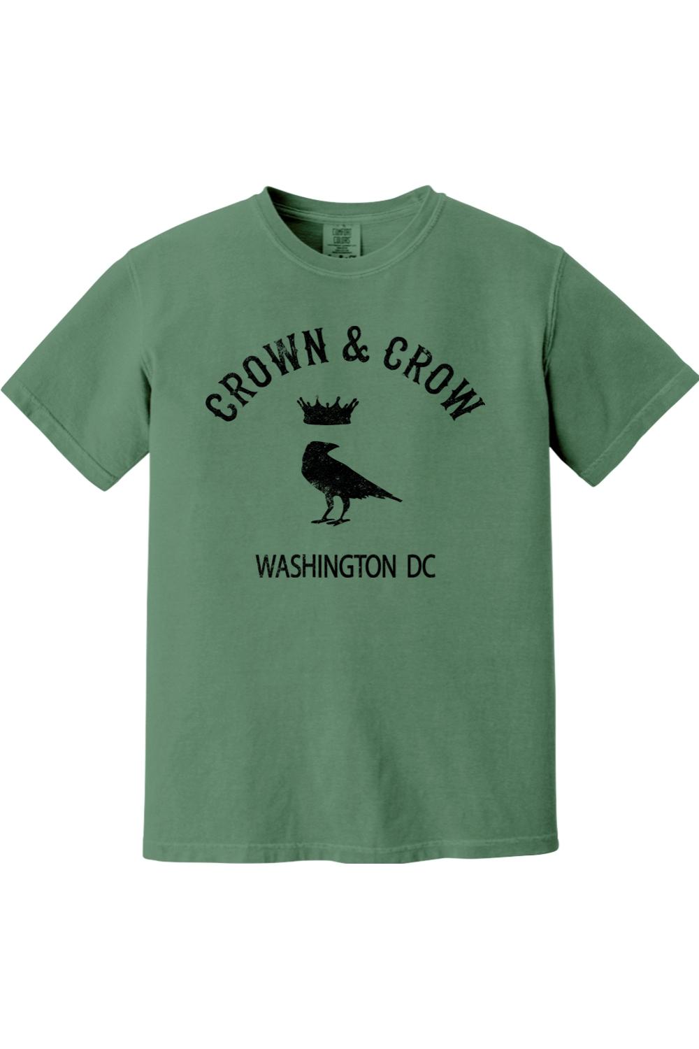 Green garment-dyed unisex t-shirt featuring a black Crown & Crow logo with a crow and crown graphic and Washington DC text.