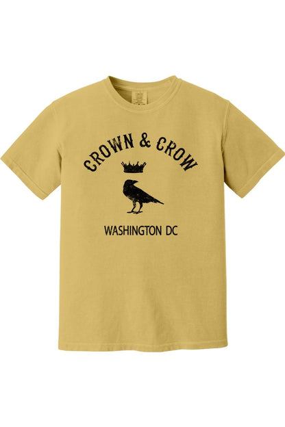 Mustard yellow garment-dyed unisex t-shirt featuring a black Crown & Crow logo with a crow and crown graphic.