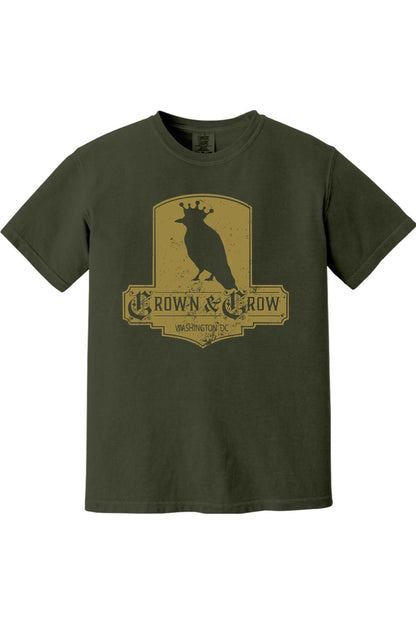 Olive green garment-dyed cotton t-shirt featuring a distressed gold Crown & Crow graphic logo on the chest.