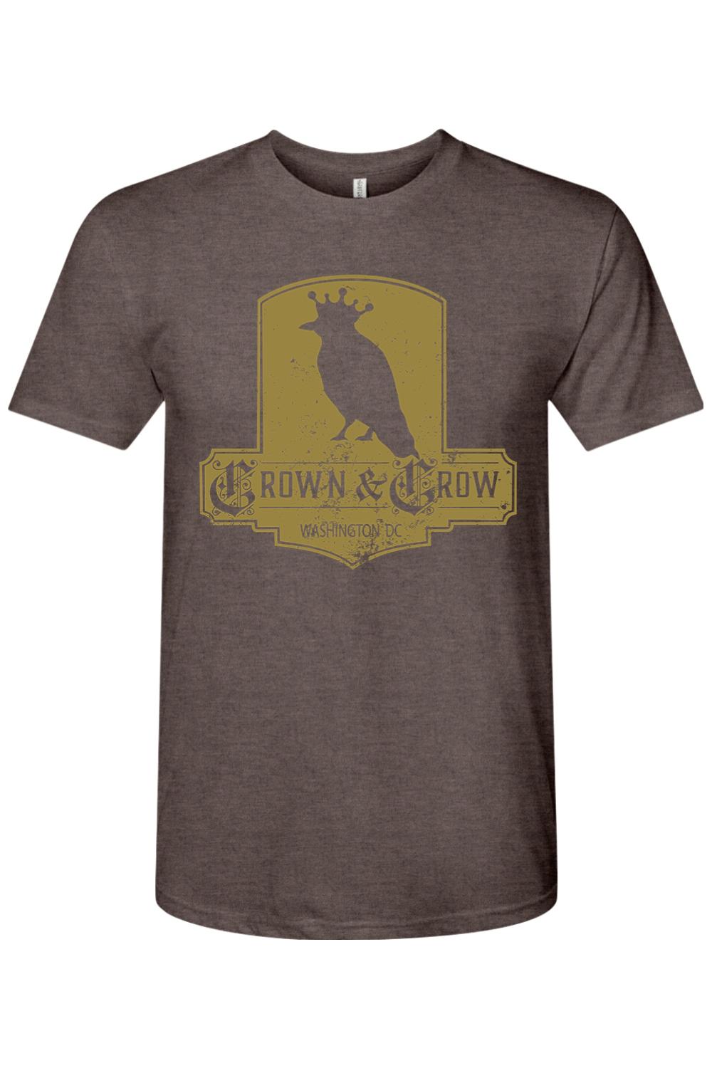 Brown tri-blend crew neck t-shirt featuring a distressed gold Crown & Crow logo graphic on the chest.