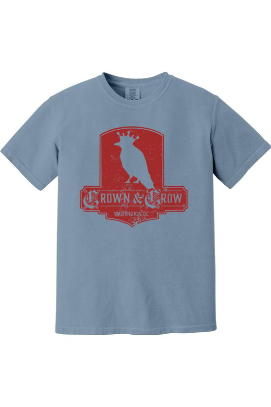 Blue garment-dyed cotton t-shirt featuring a distressed red Crown & Crow logo graphic on the chest.